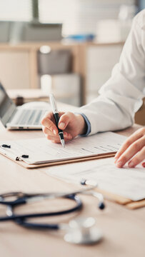 Medical doctor completing administrative healthcare records