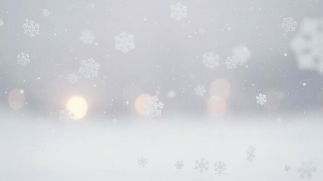 Soft falling snowflakes on a blurred winter background with warm bokeh lights for holiday and seasonal themes