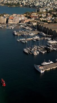 Aerial view of the Old Venetian Port of Chania with breakwater and remains of fortifications, Crete, Greece