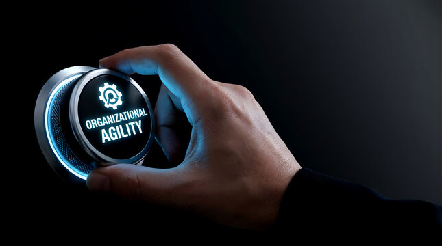 Hand pressing glowing organizational agility button to improve corporate efficiency