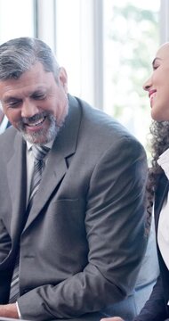 Meeting, review or people in office with laptop, training notes or team insight in business workshop. Discussion, digital or employees with tech, feedback or info recording in development session.