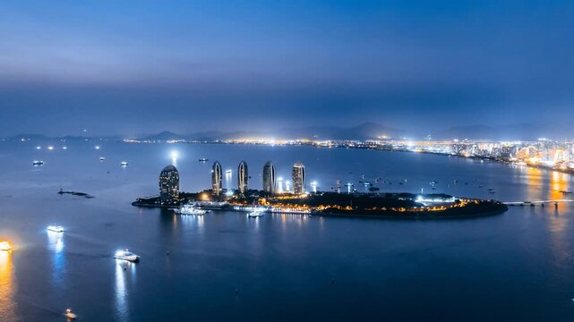 Night view timelapse of Phoenix Island in Sanya Bay, Hainan, China