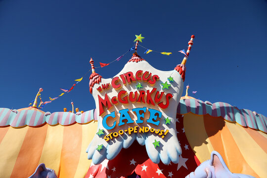 Colorful entrance of the Circus McGurkus Cafe with blue sky and space for text.