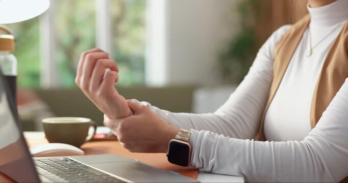 Hands, laptop and wrist pain with remote work in home, overwork or typing strain with carpal tunnel. Woman, aching joint or injury with pc for writing, WFH or freelancer with rheumatoid arthritis