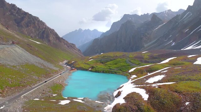 未命名Aerial view of a winding mountain road snaking through high peaks and gorges; the beautiful scenery of the Duku Highway in Xinjiang, China.项目