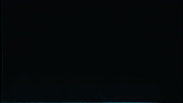 Abstract dark background with subtle blue horizontal light glow at the bottom.