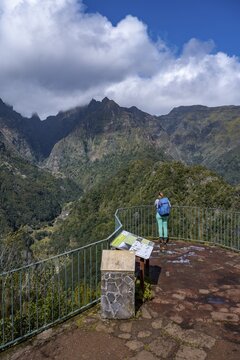 Young woman at Miradouro dos Balc&otilde;es, Ribeira da Metade mountain valley and the central mountains, Madeira, Portugal