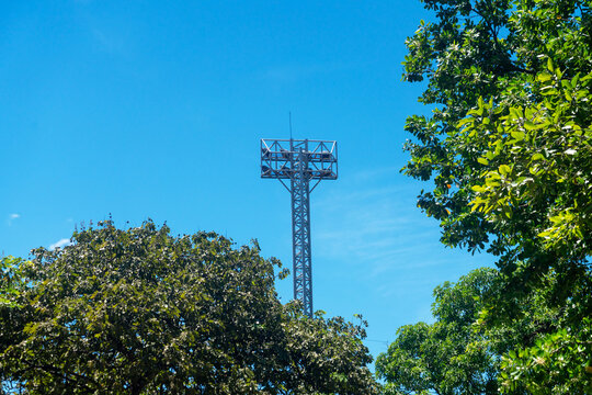 Communication Tower Above Green Foliage