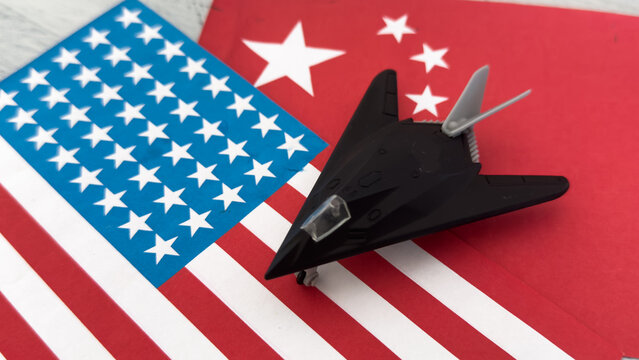Military toy airplane jet aircraft - fighter on usa flag background 