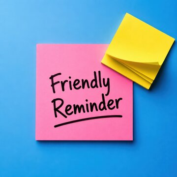 Sticky note with friendly reminder message written in black ink over bright blue backdrop.