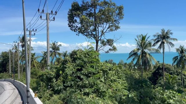 Transport traffic on road with seaview on background