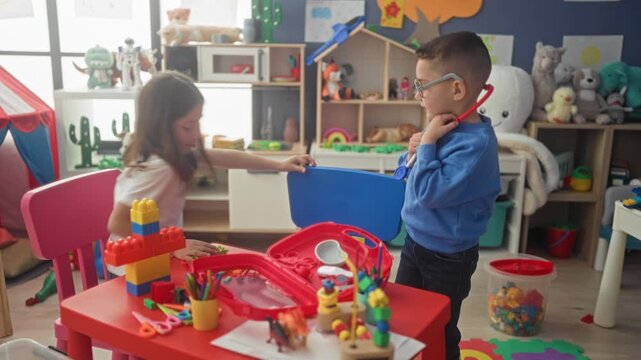 Girl and boy roleplay doctor with red stethoscope, boy listens to girl's chest and adjusts earpiece at a playroom; playful care.