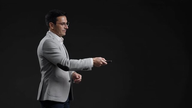 Business man presentation and leadership with speaker in suit for corporate seminar, training or office workshop. Professional, public speaking and lecturer with remote control, coach and expert