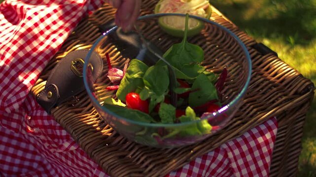 Preparing salad fresh vegatables on vintage picnic basket