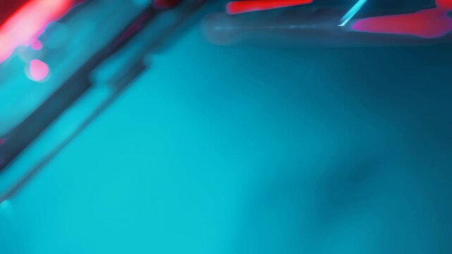 Close up side angle view of dark technological block grid with fast orange and blue laser neon.