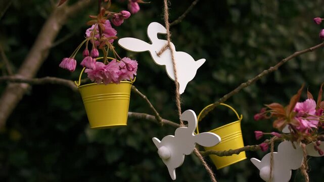 Easter bunny ears and easter decorations on blossom tree