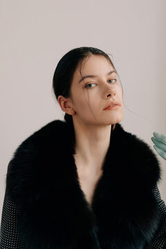 Cinematic beauty portrait with dramatic fur collar