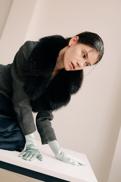 Cinematic editorial portrait with dramatic fur collar