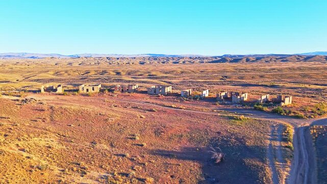 Aerial sunset view reveals the abandoned ruins of Gebo ghost town in Wyoming
