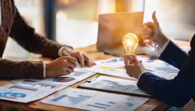 collaborative brainstorming workshop in a creative space featuring charts notes and a light bulb idea symbol on the table