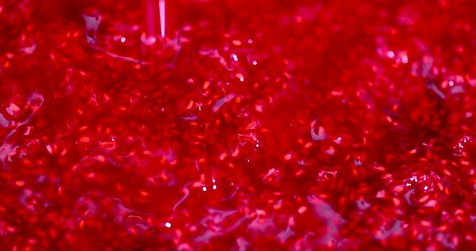   background of red grated raspberries in detail, crushed grated raspberries mixed with sugar to preserve homemade dessert for the winter