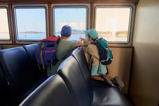 Father and child traveling by ferry