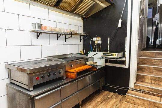 Professional commercial kitchen with flat top grill