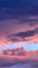 Fototapeta premium Abstract pastel sky with layered clouds and soft gradient colors creating atmospheric background and natural texture