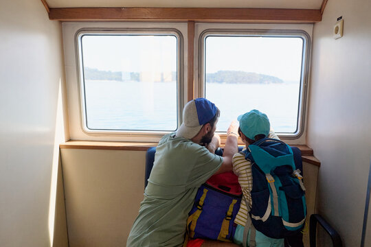 Father and child traveling by ferry