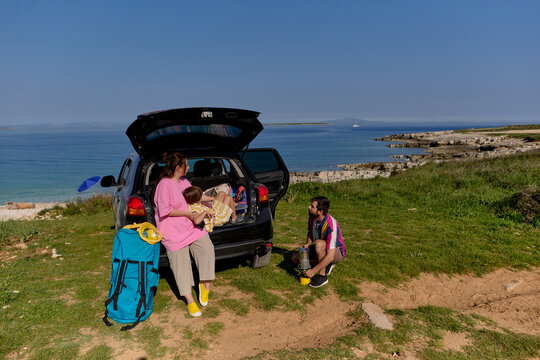 Family camping by the sea