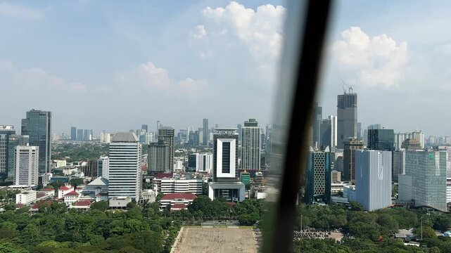 Jakarta, Indonesia - 26 Mei 2026 :A view of Jakarta from the top of the National Monument during a clear day. Tall buildings in Jakarta.