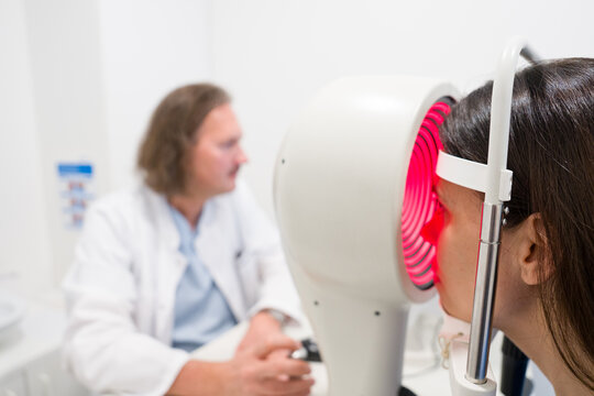 Ophthalmologist Performing Examination Using Advanced Equipment