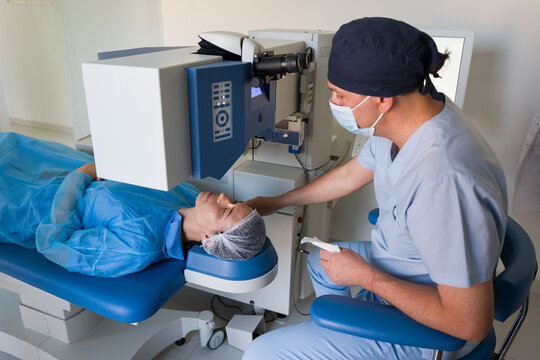 Professional Performing Eye Surgery on Patient in Clinic 