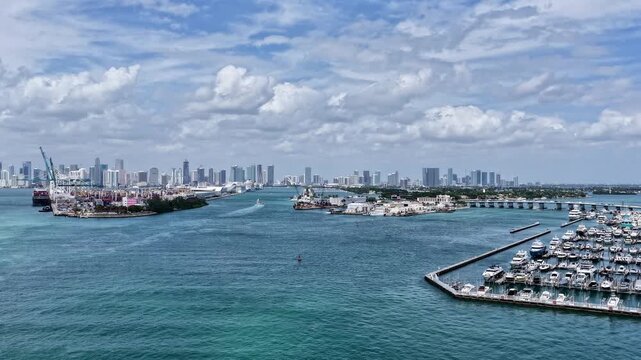 Hyperlapse aerial entering canal to Miami port. Hyperlapse aerial footage of Miami. Miami south beach aerial hyperlapse. Exploring Miami south beach. Aerial view south pointe park