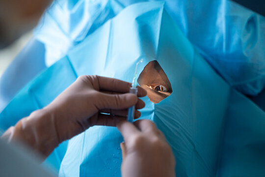 Surgeon Prepares for Eye Surgery in Sterile Environment