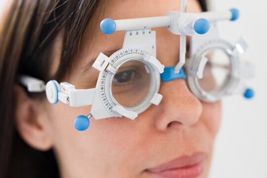 Woman Receives Eye Exam With Testing Glasses