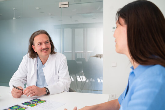 Doctor and Patient Discuss Health in a Clinical Setting