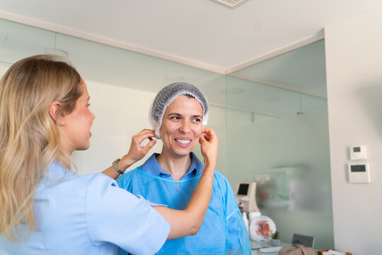 Medical Staff Help a Patient Prepare for a Procedure 