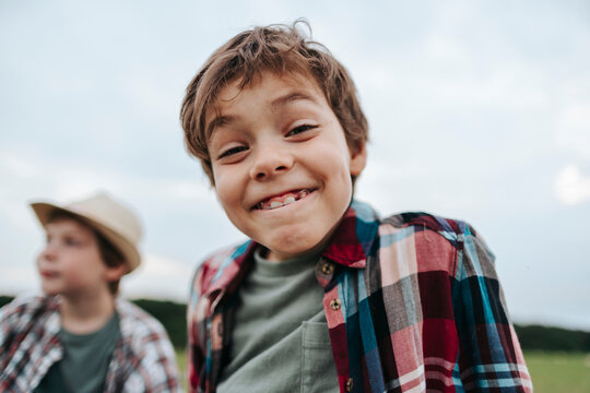 Cheerful Boy Enjoys Sunny Day Outdoors With Friends
