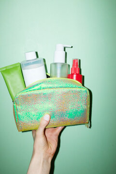 Shiny makeup bag full of cosmetic  beauty makeup projects with flash