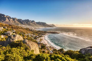Cape Town Sunset over Camps Bay Beach with Table Mountain and Twelve Apostles in the Background © romanslavik.com