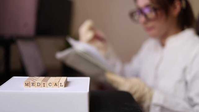 Clinical pathologist carefully reviews laboratory findings and verifies patient test documentation before approving diagnostic results in a modern medical laboratory