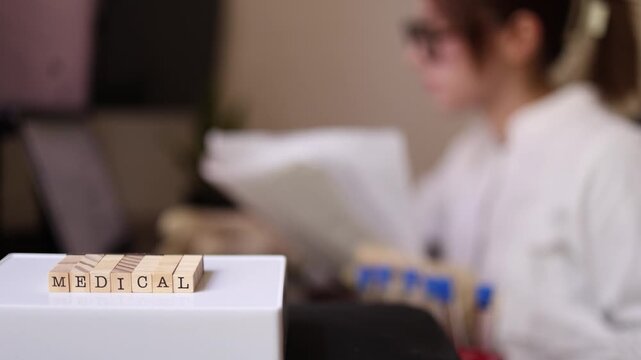 Young medical laboratory intern prepares for patient diagnostics in a modern clinic reviewing clinical protocols before biomarker analysis and precision medicine testing