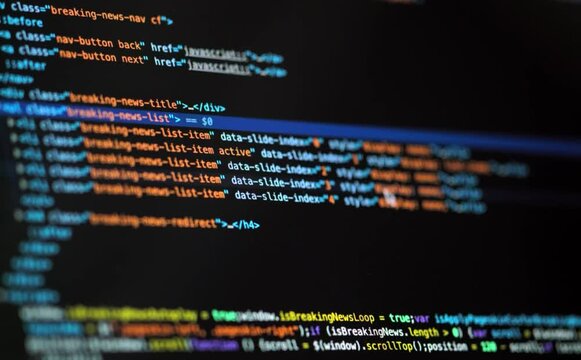 Developer is browsing html code on the computer screen. HTML Web Page Code Scrolling Programming code abstract technology background for software developer and Computer script concept