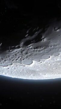 Vertical video: Shifting camera revealing terminator and crater rims in space, showing textures