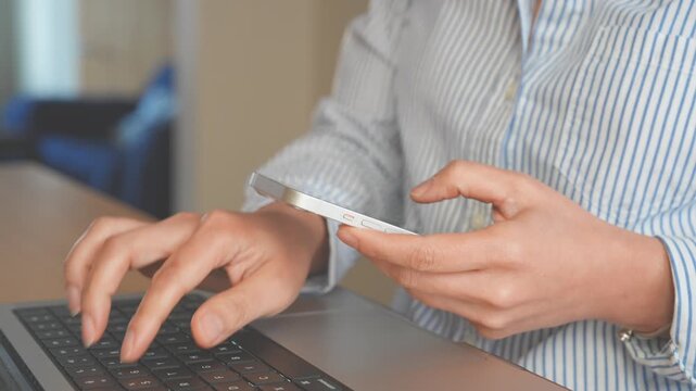 Professional using smartphone, Laptop for business communication, SaaS Applications, AI Powered workflow automation. CRM management,Productivity tools,Remote work, Collaboration, Digital transformatio