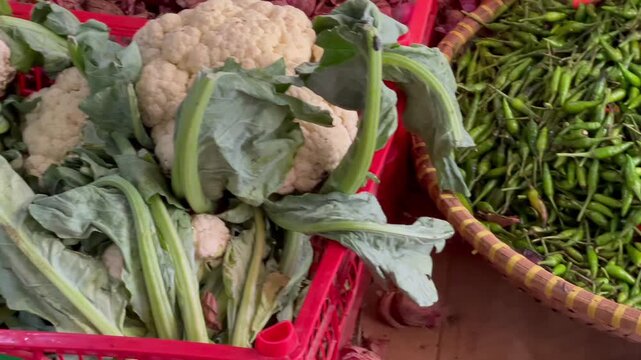 Assorted fresh vegetables in a traditional market stall