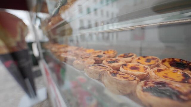 Traditional portuguese pastel de nata in a bakery window