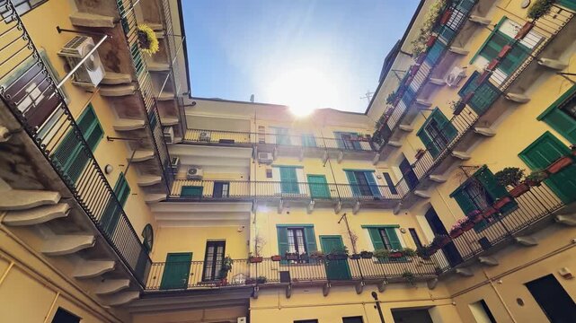 Vibrant Milanese Courtyard: Historic Italian Apartment Building