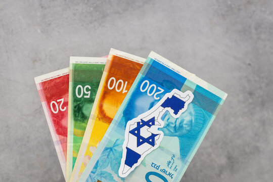Israel money and national emblem  Gray background, copy space, flat lay, Financial and business concept